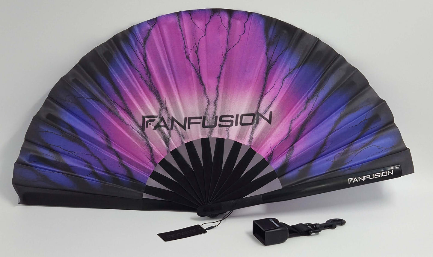 Stormfade hand fan – rave fan with clip holder and holster attachment. Wearable techno accessory for outdoor festivals, EDM events and high energy open airs.